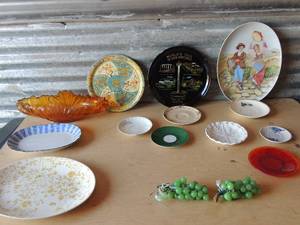 lot 291 image: Brown glass centerpiece 2 glow in the dark grape designs various dcor plates 1 bavarian saucerm 1 red glass plate, 1 2903 caddilac plate and more
