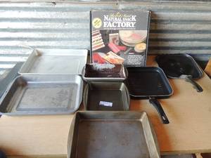 lot 301 image: Natural snack factory NIB 2 flat skillets, 3 large baking pans, 2 bread pans, 1 square cake pan
