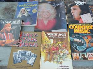 lot 62 image: Music books-dolly parton scrapbook, Elvis book country music x 5 and more