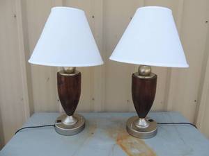 lot 32 image: 2 heavy dark brown single light lamps, extra plug in base comes with 2 like new white shades