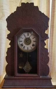 lot 39 image: ANTIQUE OAK PRESSED GINGERBREAD  KITCHEN CLOCK (IT WORKS)