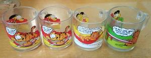lot 49 image: VINTAGE MCDONALDS COLLECTIBLE GARFIELD CUPS (SET OF 4)