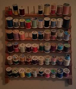 lot 110 image: LOT OF ASSORTED SPOOLS OF THREAD IN WALL ORGANIZER