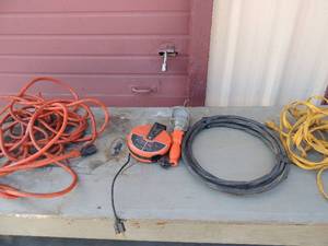 lot 433 image: Yellow extension card, orange heavy duty extension cord,   20 reel light,   black copper wire