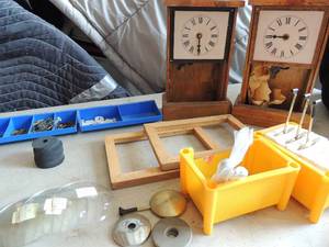 lot 390 image: Clock repair material  - time hands, PENDELUMS ,  2 CLOCKS and glass covers
