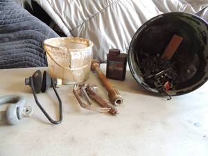 lot 394 image: Bucket of nails, grout sealer, misc. bucket of peg board brackets large bolts clamps, paint sprayer and more