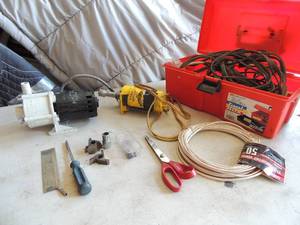lot 399 image: Hi Tork starter,  water pump,  router bits    red box with various wires and cords