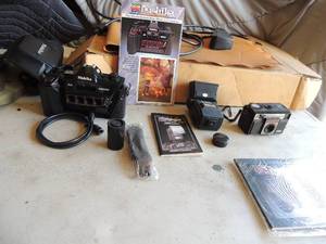 lot 401 image: Nishika 35mm 3-D camera, Nickita twin light 3010 camera model #n8000 3 d camera strap operating book