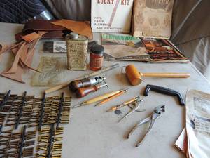 lot 407 image: Instructional books on leather crafting, leather tools ,patterns, and  plus leather pieces