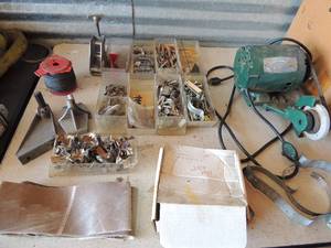 lot 365 image: Electric grinder  r corner brackets, wood dowels, screws, bolts, spool of wire and paper and more