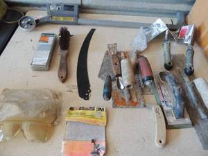 lot 366 image: Drywall corner tools,  epoxy float concrete  trowels, palm sander sheets, pole saw blade, 20 saw chain, 3 pair safety glasses and stripping wand (used)