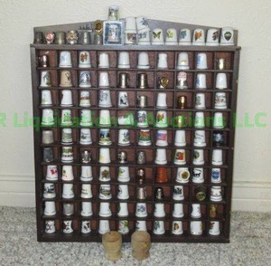 lot 85 image: Thimble collection including a Sterling thimble plus display case