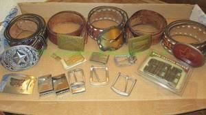 lot 77 image: Assorted belt buckles and leather belts as shown
