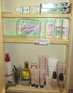 lot 72 image: Contents of cabinet including health & Mary Kay beauty supplies