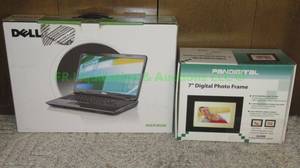 lot 87 image: Dell Inspiron laptop in box & digital photo frame
