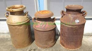 lot 487 image: Antique metal large milk jugs