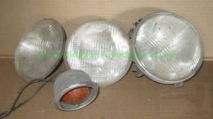 lot 493 image: Vintage automotive head lamps