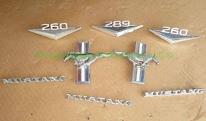 lot 431 image: 1965 Ford Mustang 289 & 260 engine and body emblems