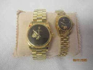 lot 246 image: 2 ROLEX OYSTER PERPETUAL HIS &amp HERS STAMPED 18K BOTH STILL WRAPPED IN PLASTIC AUTHENTICITY UNKNOWN PLEASE PREVIEW