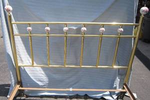 lot 135 image: Brass bed with ceramic finials