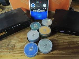 lot 513 image: 7 cases of blank NIP CDs, I live Karaoke machine no mic, RCA 5 disc CD music changer no speakers Sony DVD changer