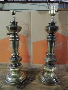 lot 515 image: 2 very heavy brass lamps 1 has a broken socket but has a new one to replace it no shades
