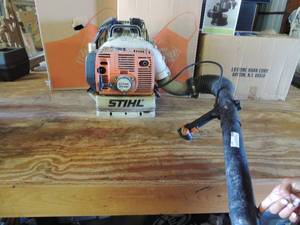 lot 557 image: STIHL power blower industrial use with straps to back gas power and push button  for control on handle