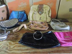 lot 573 image: Purse lot- Crabtree & Evelyn pink makeup, VP small, M initial light brown leather, cheetah print makeup and others