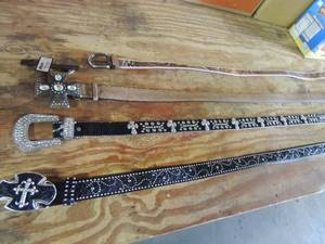 lot 578 image: Womens belt lot- camo s-m, Brown NOCONA Cross buckle size large, , Sparkle cross design belt XL  TONY LAMA size 38 leather cross belt - SOME WITH TAGS
