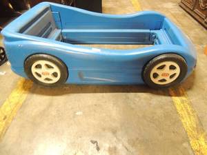 lot 599 image: TYKES blue racecar bed 68x41