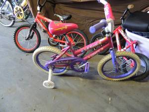 lot 540 image: Lil Gen girls bike with training wheels, Rocket Next boys bike no kick stand    Huffy red boys bike missing seat
