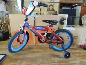 lot 542 image: Spider man little boy bike with training wheels 15 seat has small tear
