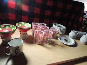 lot 494 image: Christmas lot- no brand creamer, sugar, butter, S&P set 8 saucers 7 red egg cups Santa and snowman candle sticks