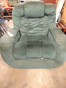 lot 682 image: Oversize dark forest green recliner with remote. Built in massager heater zones