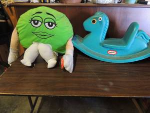 lot 689 image: Very large plush green M&M, Little tykes plastic green rocking horse 33l x 18 high