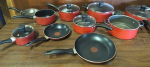 lot 691 image: T-fal pots and pans set, 5 sauce pans 4 have lids pasta pan with kid and covered skillet