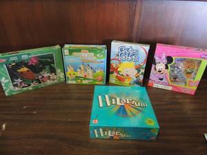 lot 694 image: The game of Hilarium, Minnie Pop up game, Chutes and ladders, Castle logic, 100 piece jigsaw puzzle all brand new