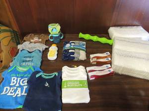lot 700 image: 2 packs o size 1 huggie snugglers, 6 onsies size 0-3 months, 1 pack of flannel receiving blankets, 3 A&D oinment. 2 zinc oxcide, weeda set 6oz non spill Sippy cup