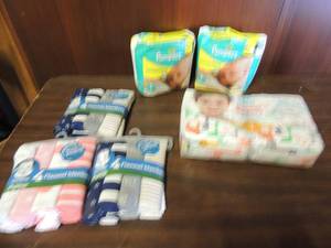 lot 702 image: 7 packs of swaddlers pampers, 1 pack of size 1 honest diapers 1 boy 1 girl flannel blankets