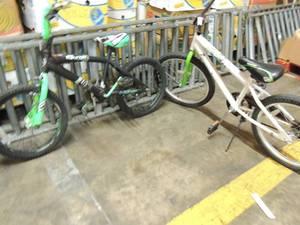 lot 726 image: Grizzled Mantis green and white boys bike and Surge Race team Turquois and black boys bike