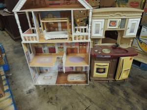 lot 728 image: Doll house needs TLC 49tall x 32wide has bed, and  little tykes step 2 all in one kitchen 39 x 24w