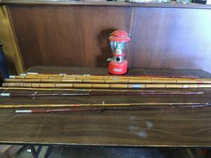 lot 733 image: Lot of various size  cane poles for fishing. A Colman rechargeable lantern doesnt have charger