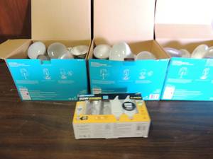 lot 734 image: 3 boxes of new and used 60 and 65 watt light bulbs for security lights and flood lights NIB flame tip 40 watt electric light bulbs