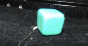 lot 750 image: 1  cube of genuine turquoise on wire
