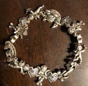 lot 854 image: Avon Jewlery ALL NEW- Sterling silver genuine ruby ring size 6, Cherub slide bracelet size large and Sterling silver genuine pearl and blue topaz ring size 7