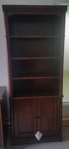 lot 2 image: HAVERTYS MARTINS LANDING 2-DOOR BOOKCASE (RETAILS FOR $699)