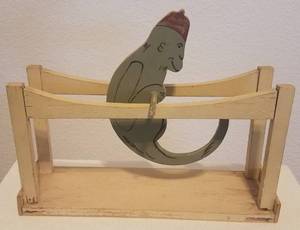 lot 86 image: ANTIQUE AMERICA TOY COMPANY WOODEN PARALLEL BARS MONKEY TOY (YES, IT WORKS)