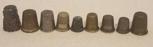 lot 94 image: VINTAGE THIMBLES INCLUDING STERLING SILVER