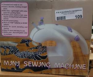 lot 109 image: MINI SEWING MACHINE (NEW IN BOX)