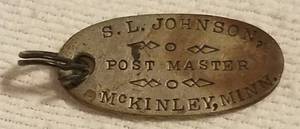lot 106 image: ANTIQUE 1901 PERSONALIZED POST MASTER MEDAL